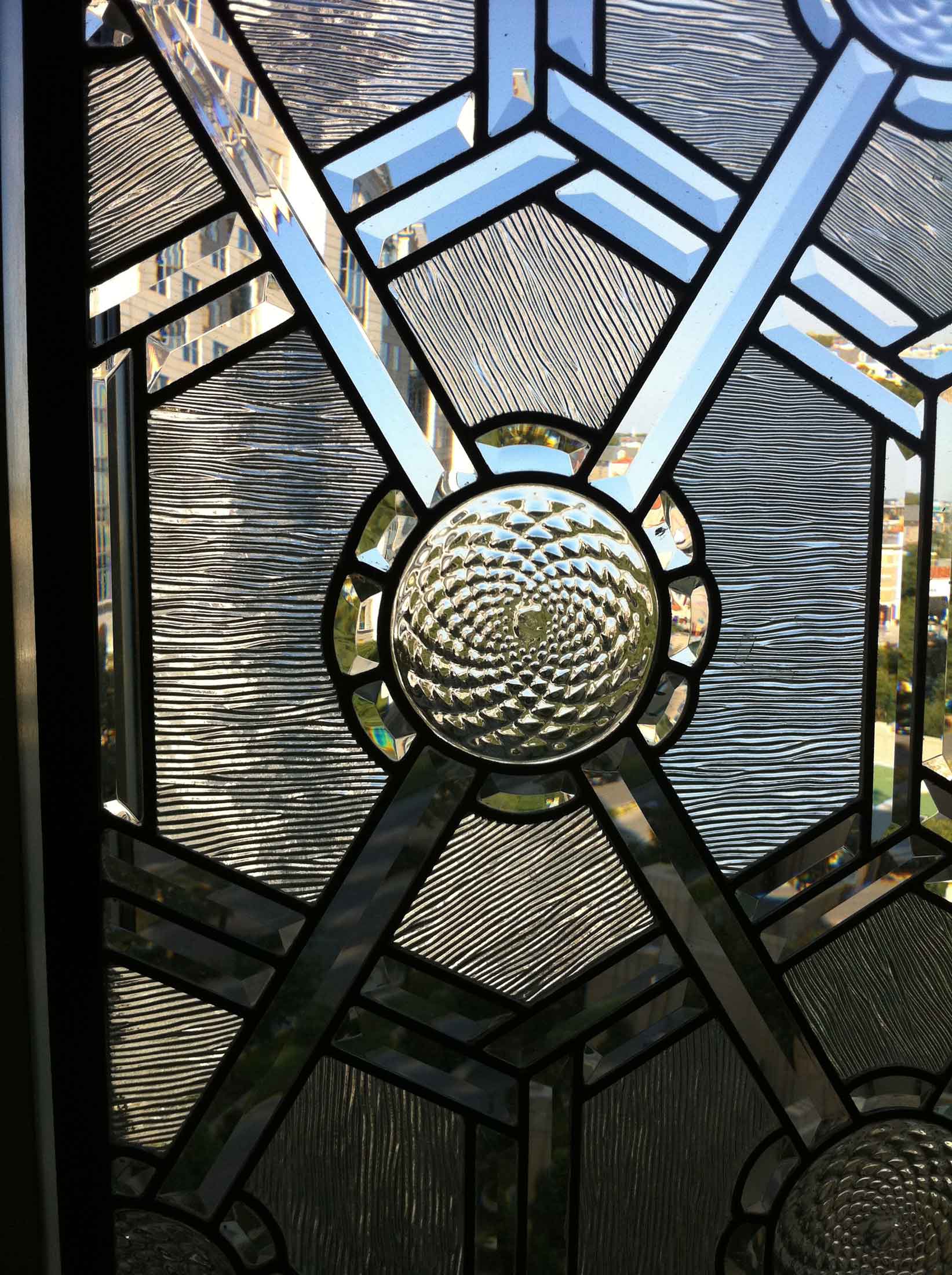 Custom cut art glass window design with geometric shapes