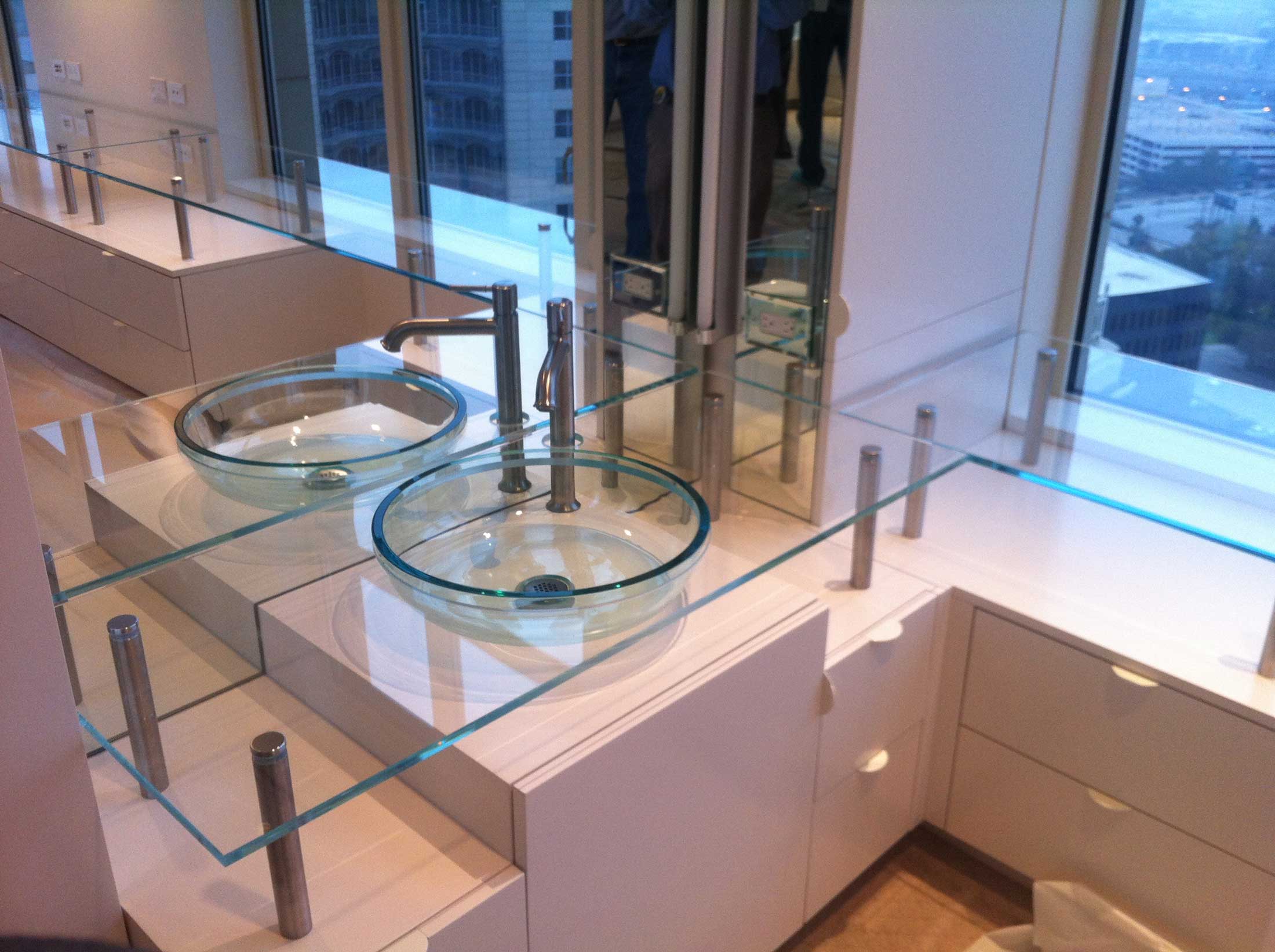 Bathroom with glass sink and counter