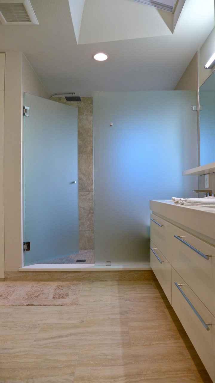 Bathroom with frameless glass shower doors