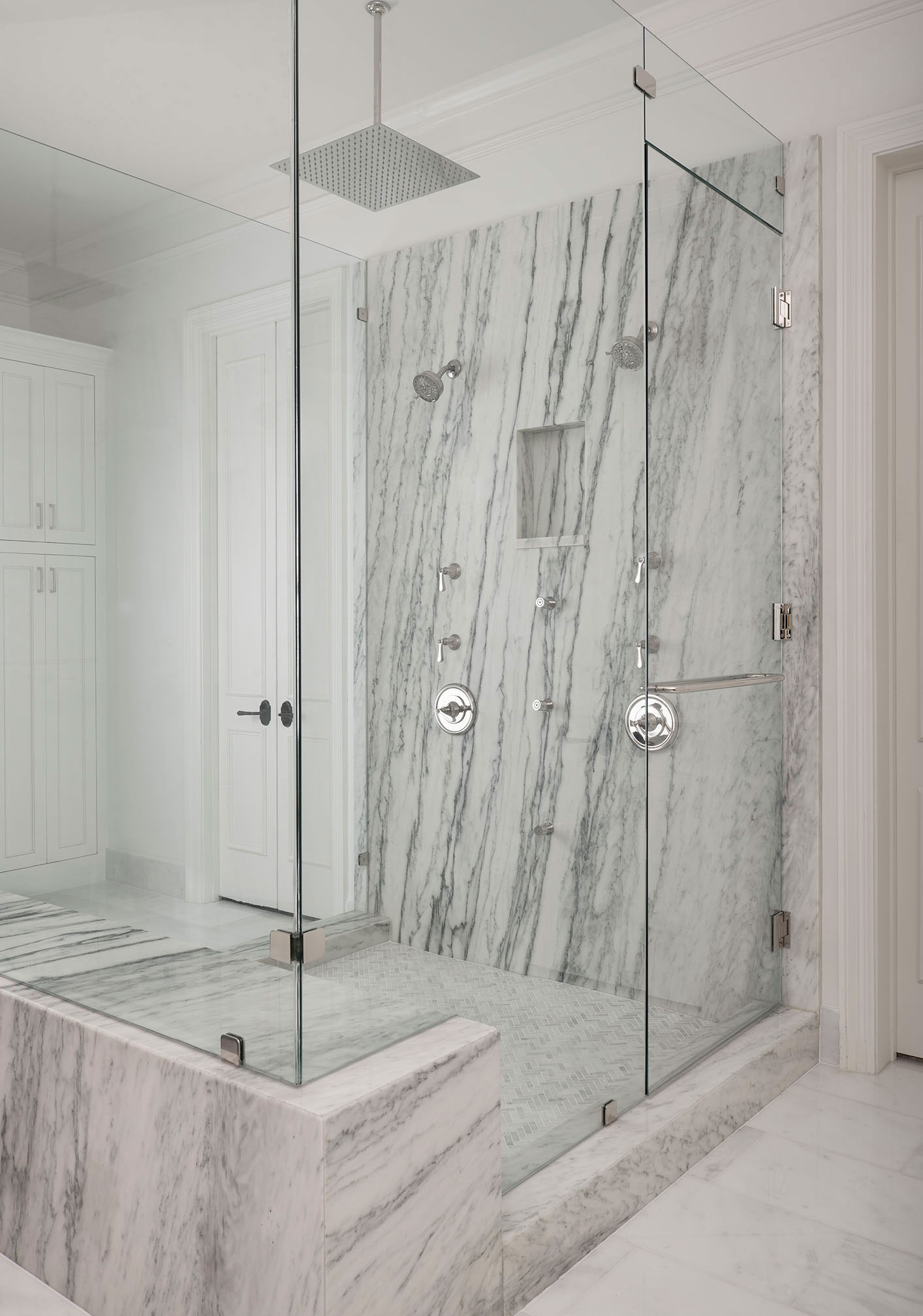 Marble shower with frameless glass shower doors